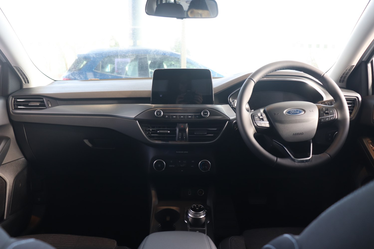 Dashboard with touchscreen display, multifunction steering wheel