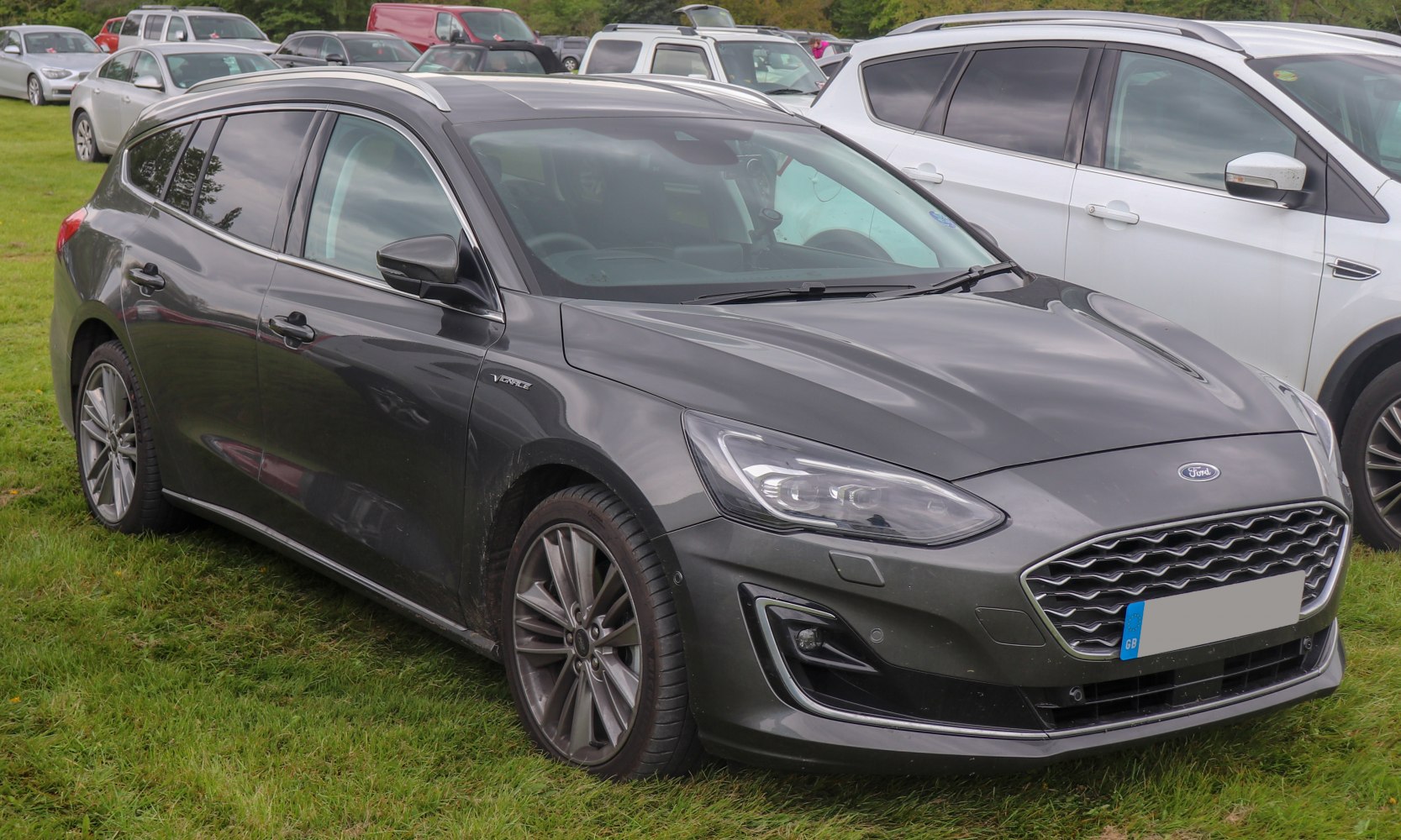 Front and side exterior with headlights and alloy wheels