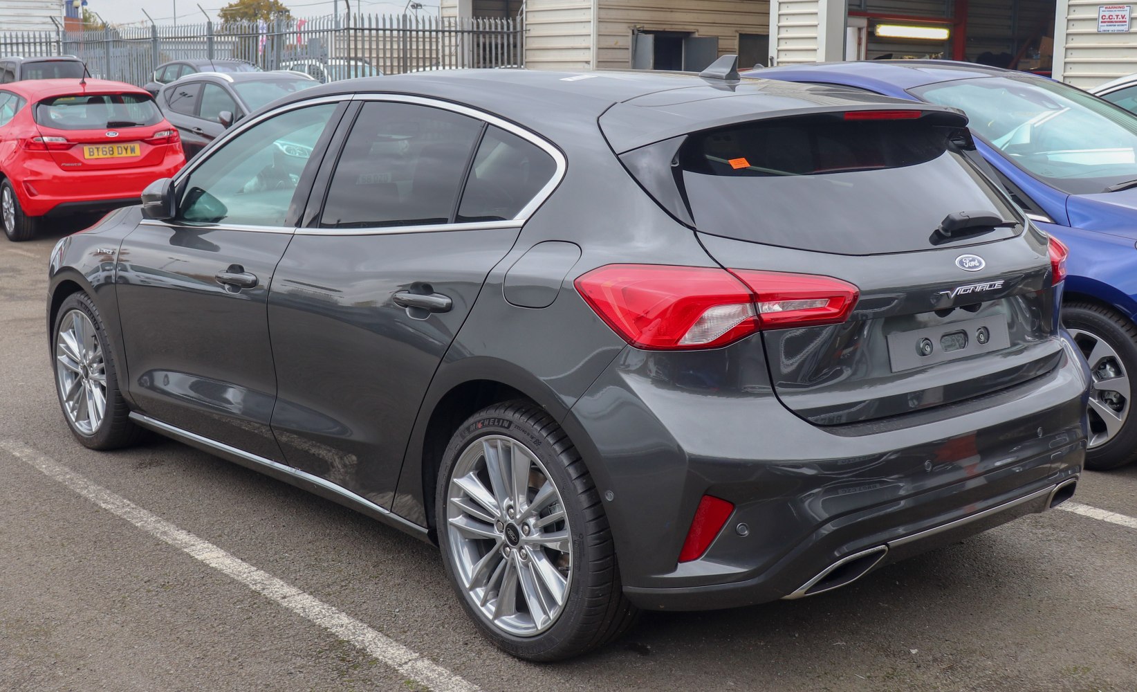 Rear side view with sharp tail lights and alloy wheels