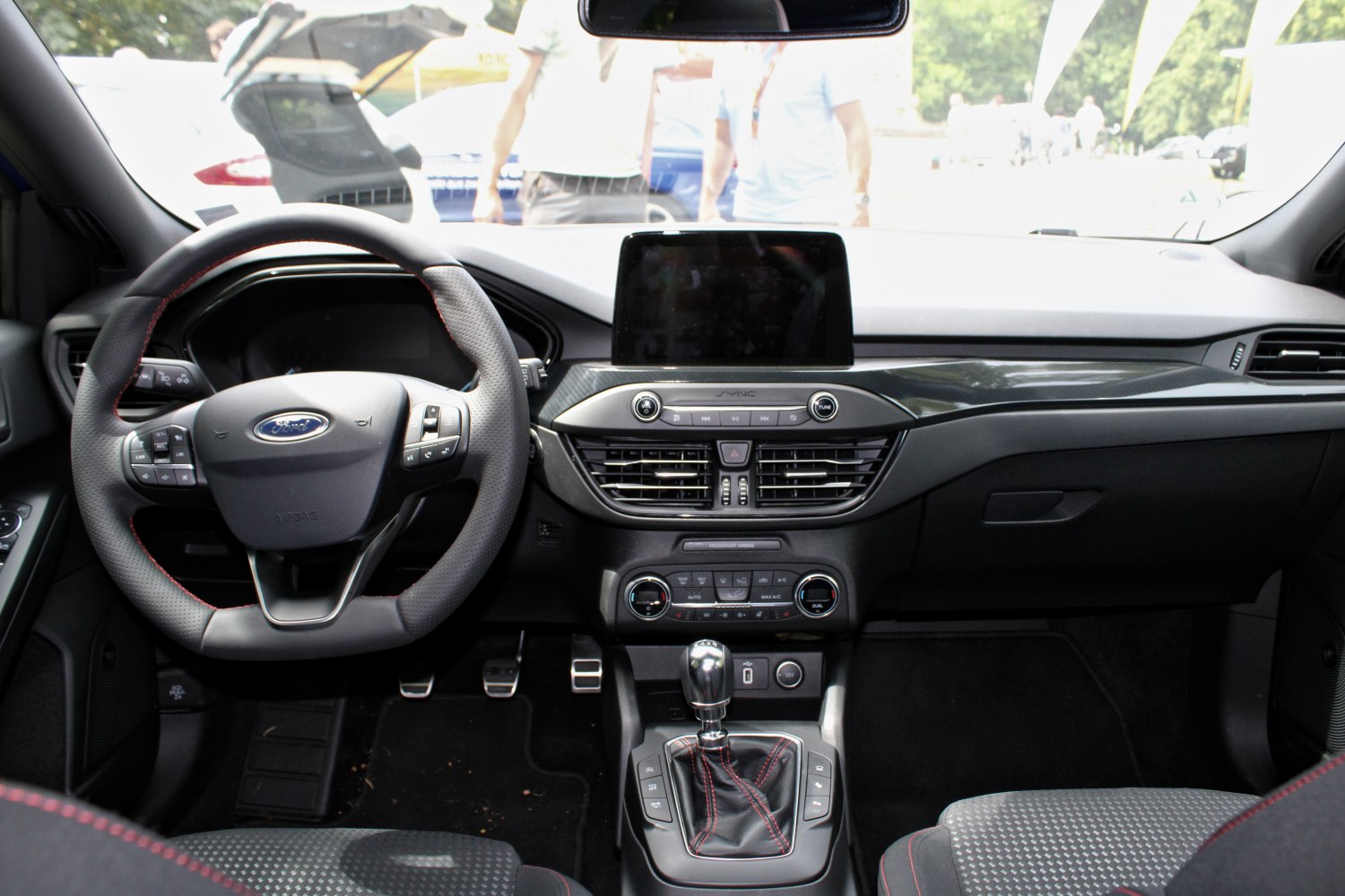 Dashboard and steering wheel with center console and infotainment screen