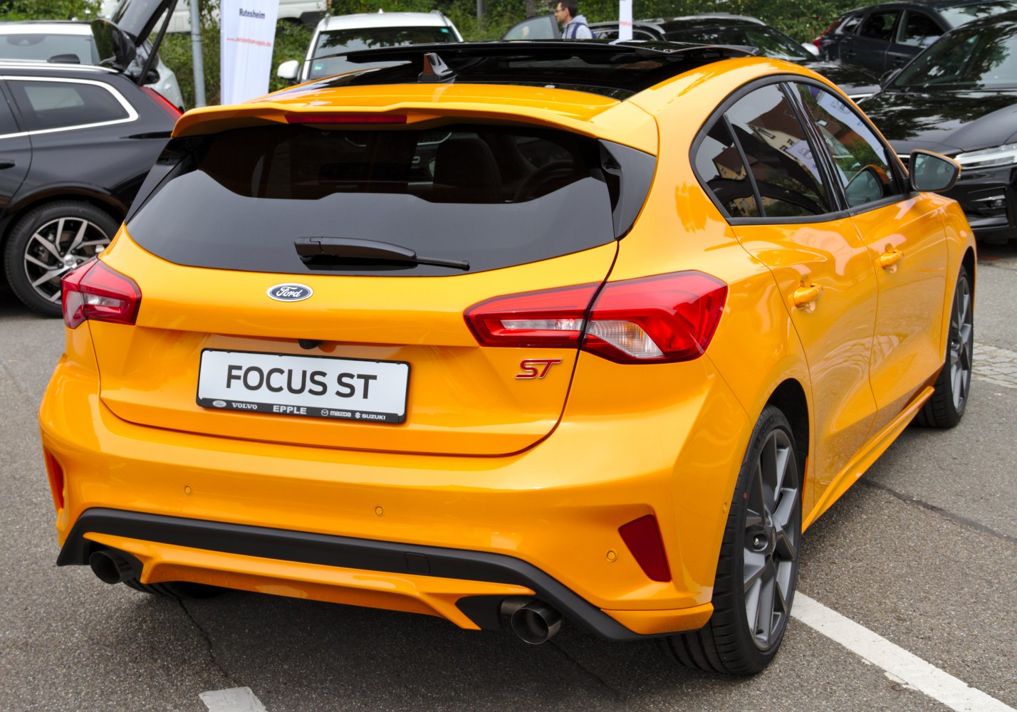 Rear view of sporty hatchback with dual exhaust and sharp tail lights