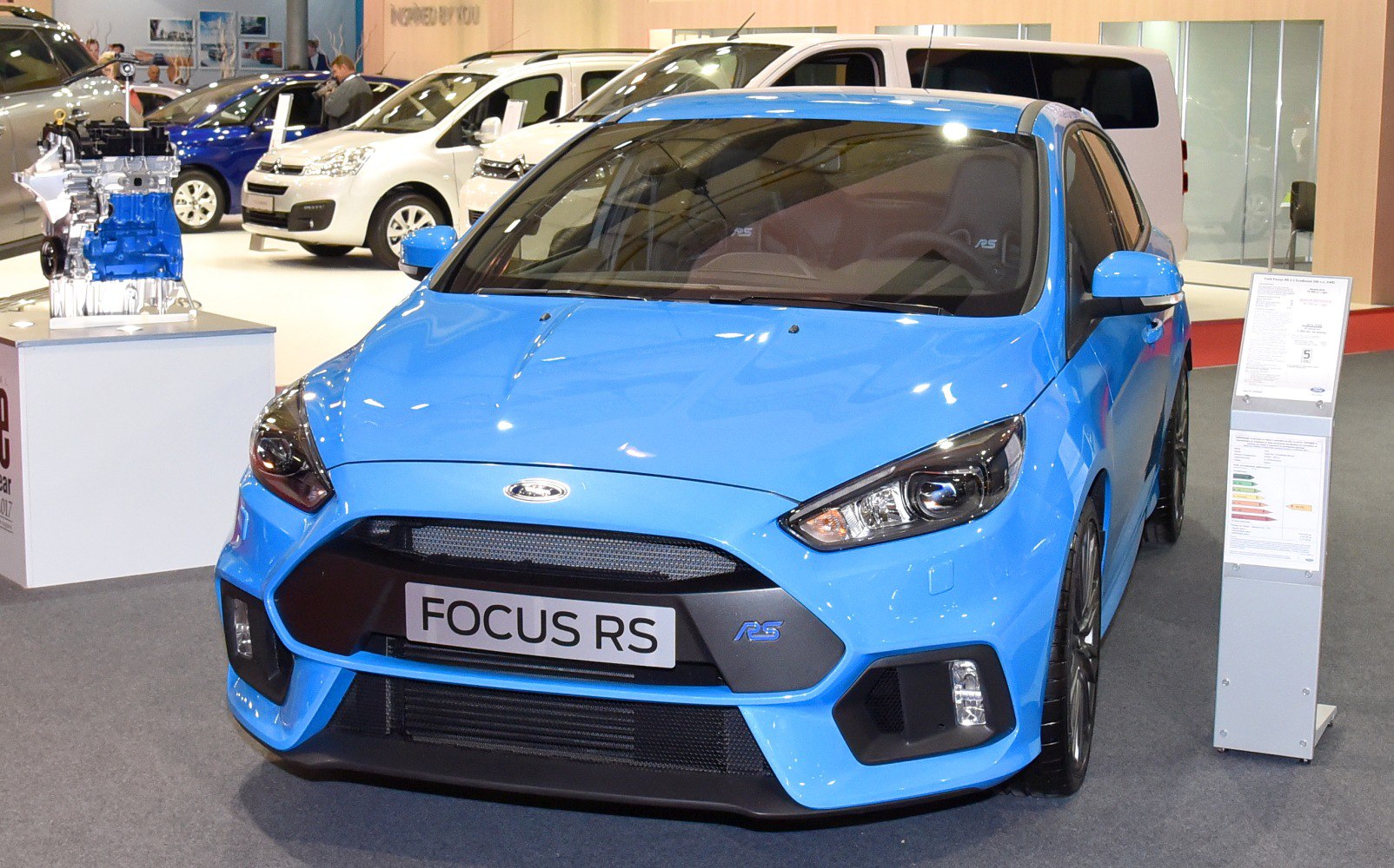 Sporty hatchback front with aggressive headlights and grille