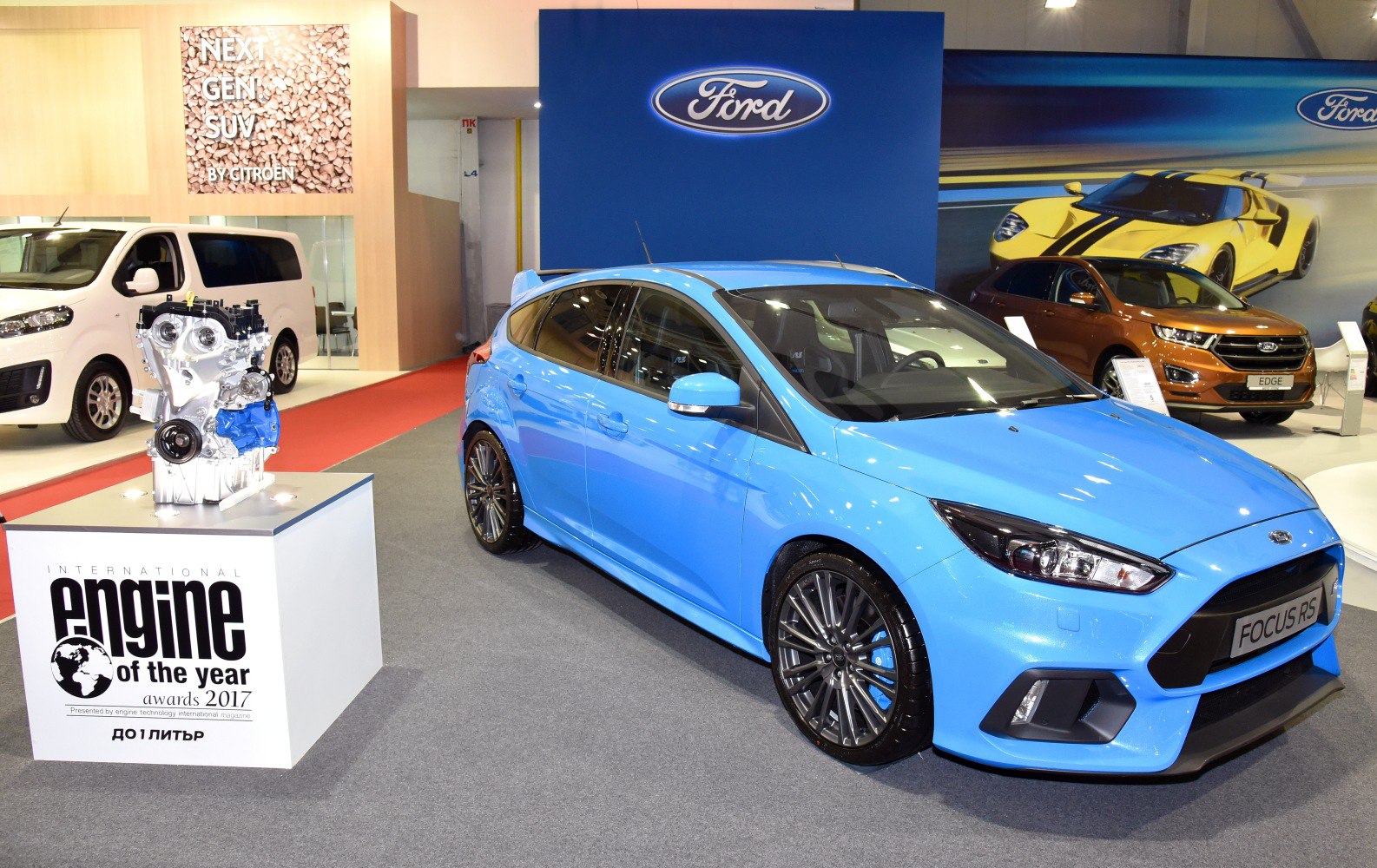Blue Ford Focus RS hatchback with sporty front and alloy wheels