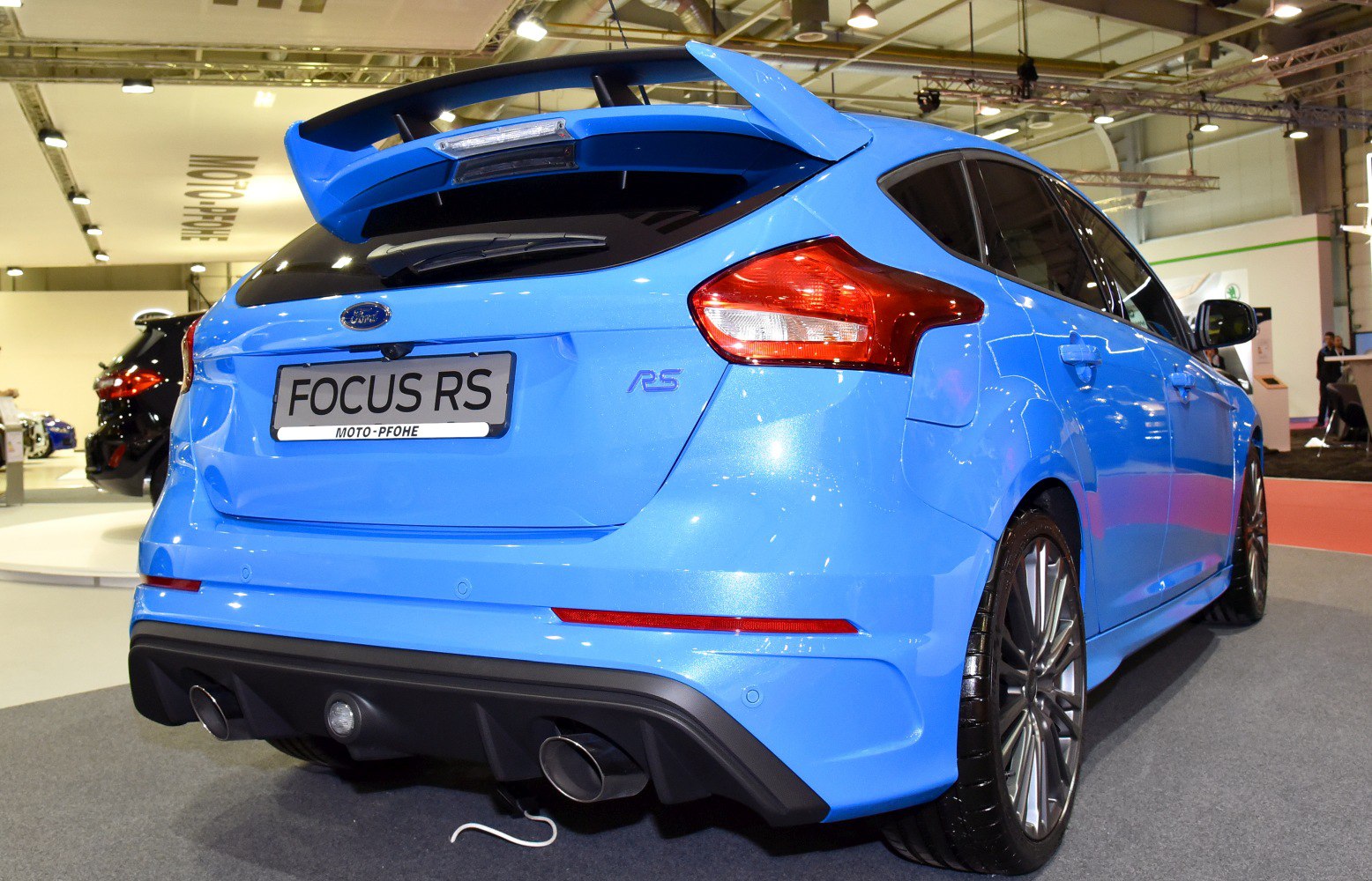 Sporty rear hatchback with spoiler and dual exhaust tips