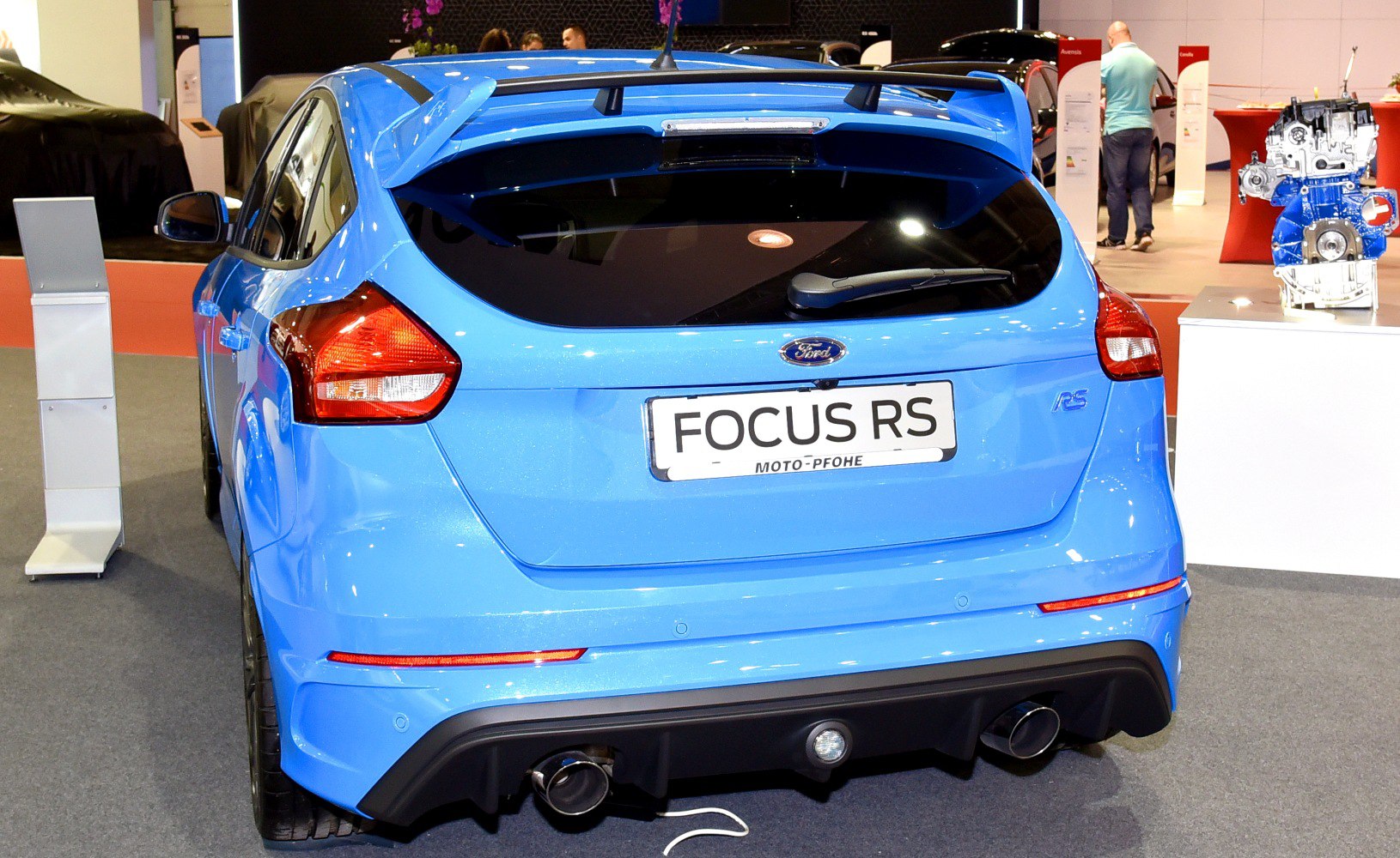 Blue hatchback rear with spoiler and dual exhaust