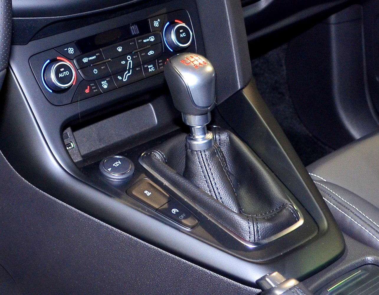 Manual gear shifter with climate control panel and dashboard buttons