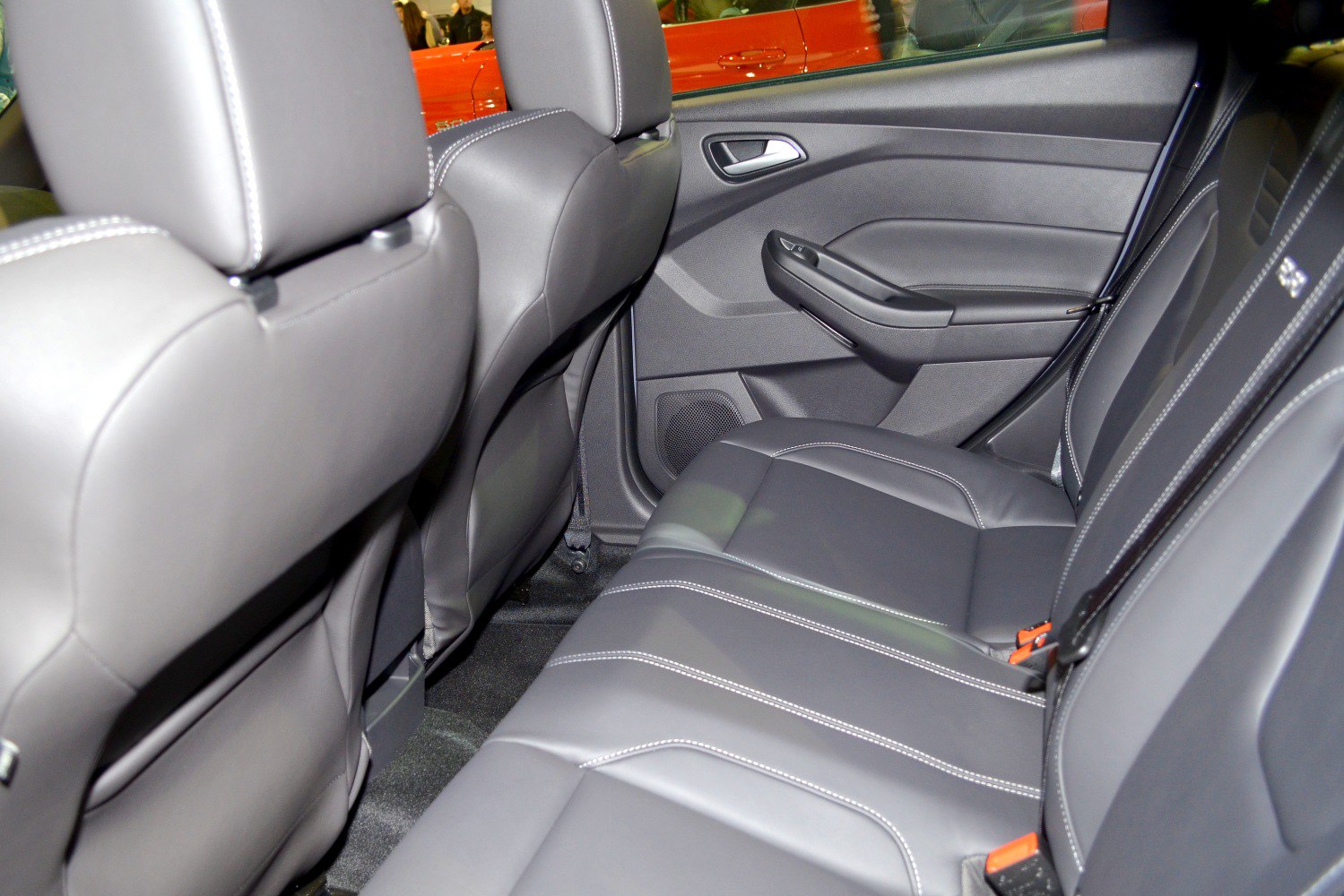 Rear seat interior with leather upholstery and door panel of modern hatchback