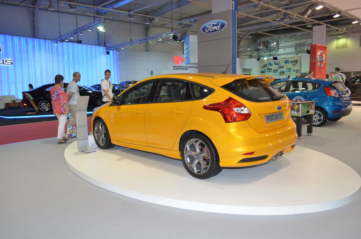 Bright yellow hatchback with sporty design and alloy wheels
