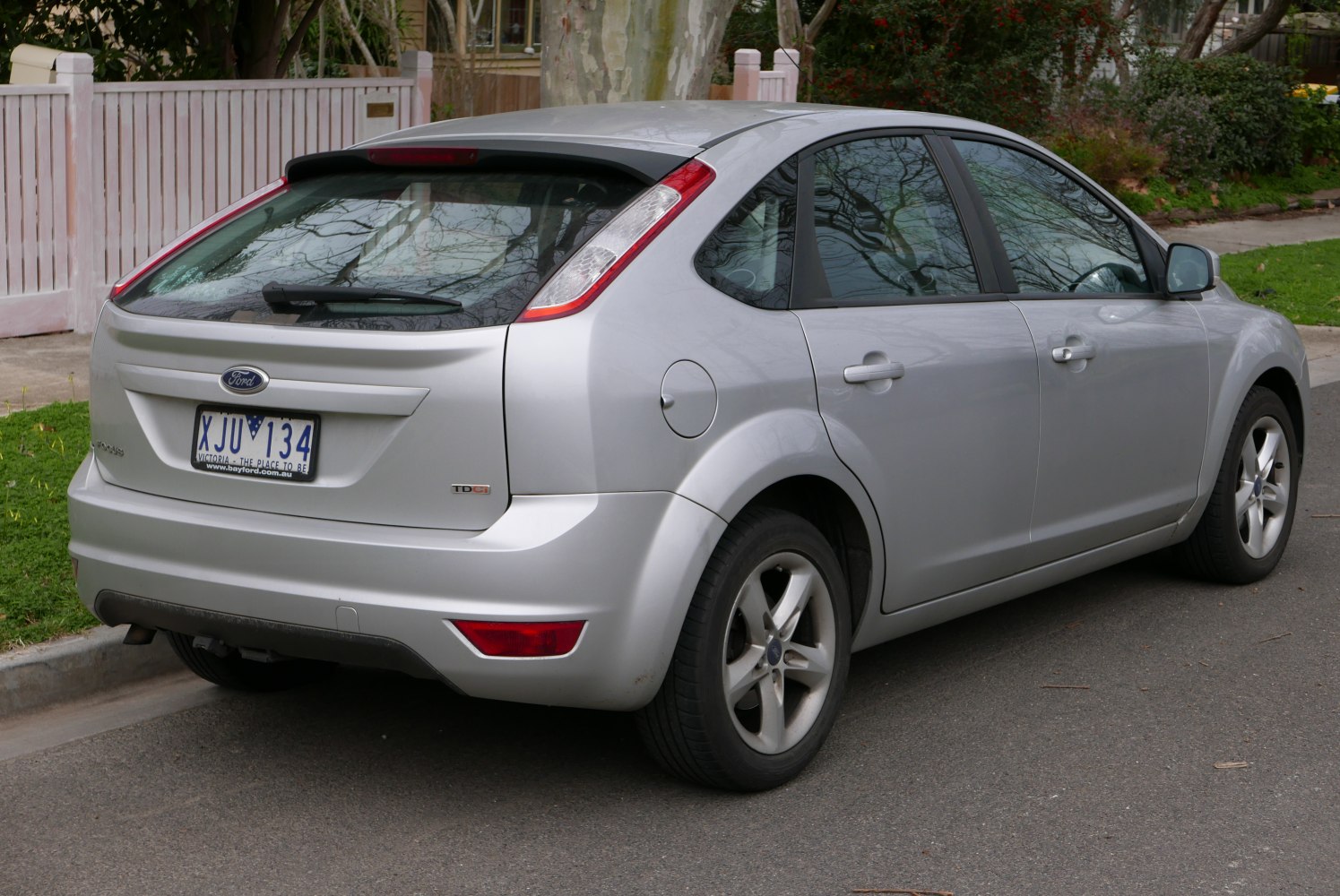 Compact hatchback rear view with distinct taillights and rear windshield wiper