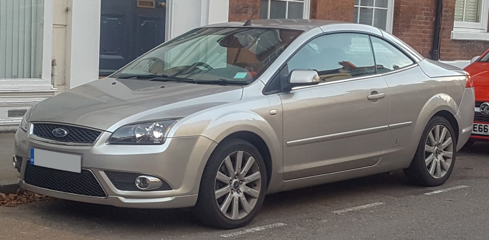 Silver coupe convertible with front-side view and alloy wheels