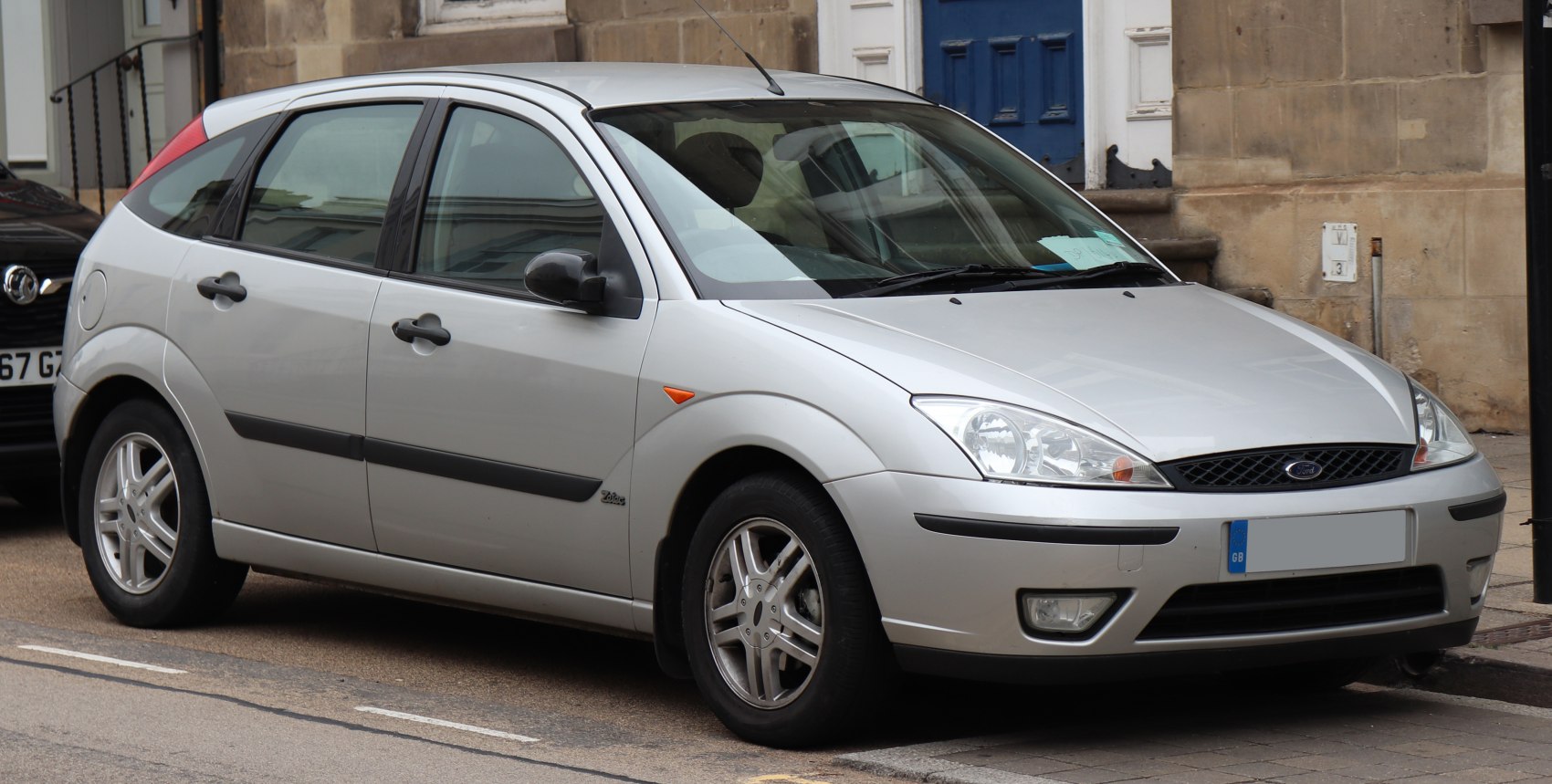 Silver hatchback with rounded headlights and alloy wheels