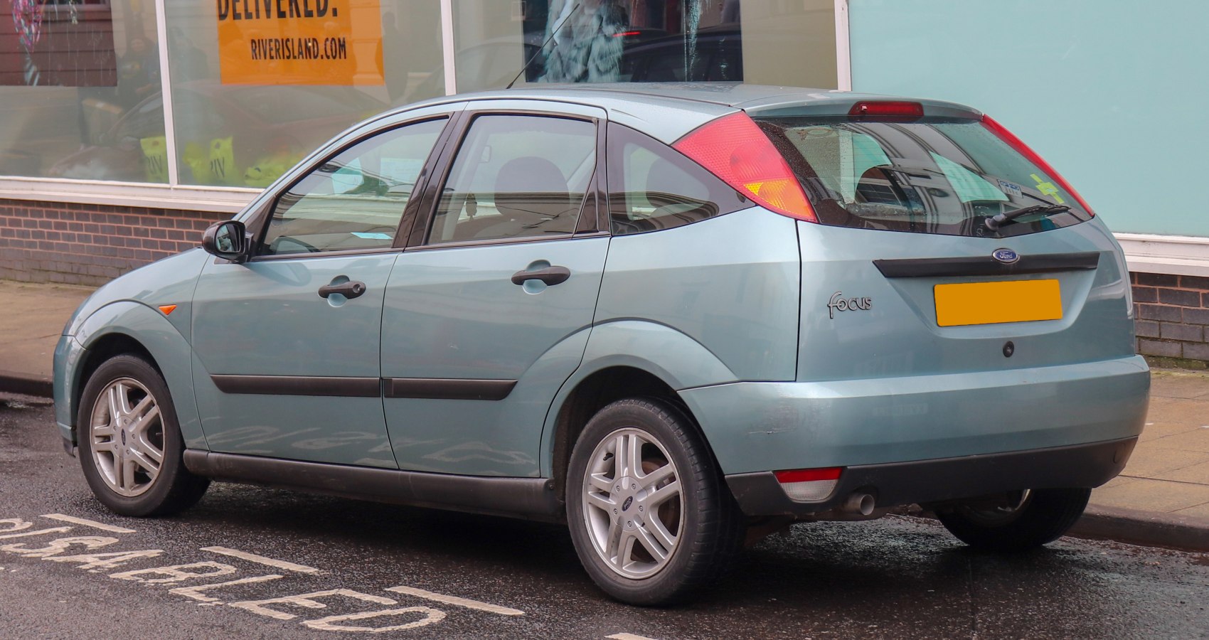 Rear side view of hatchback with alloy wheels and distinct taillights