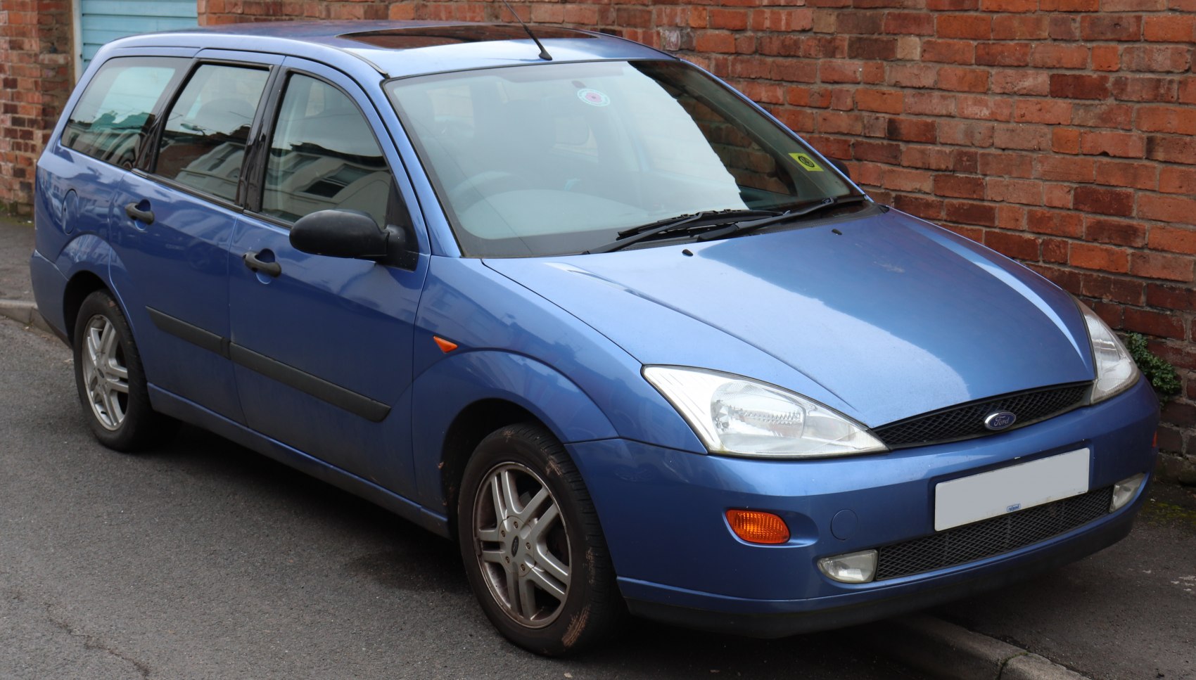 Blue mid-size wagon with front and side view details