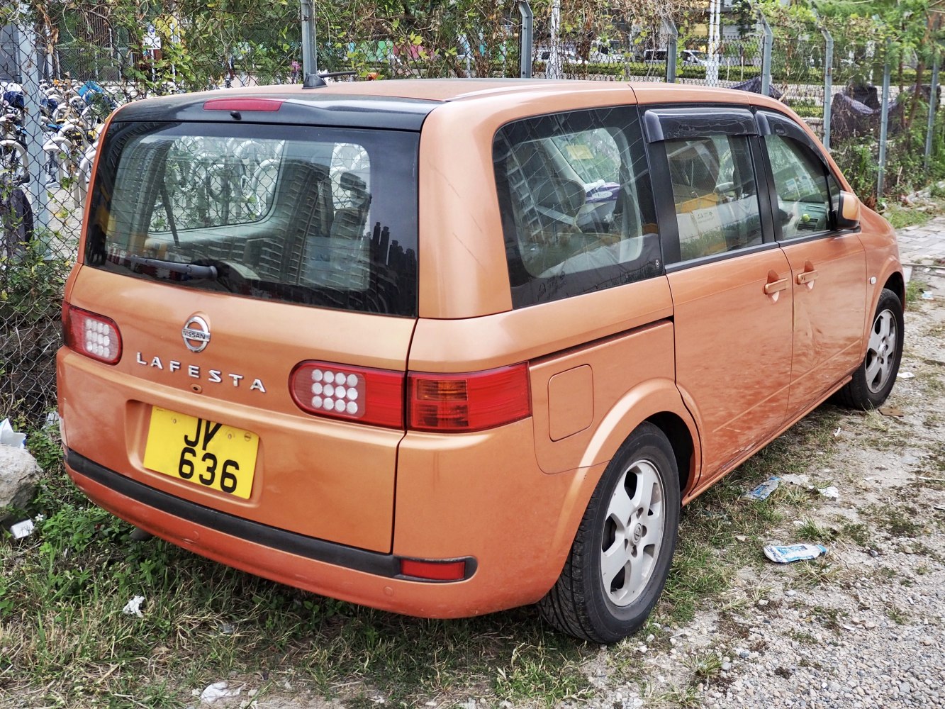 Rear view with unique taillights and compact boxy design