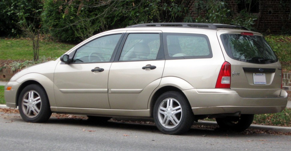 Side profile of beige station wagon showing body shape and alloy wheels