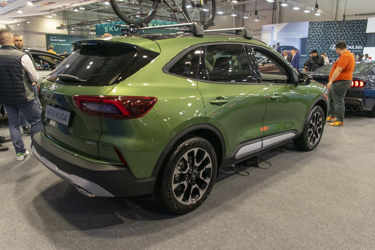 Green SUV rear and side view with alloy wheels and roof rack
