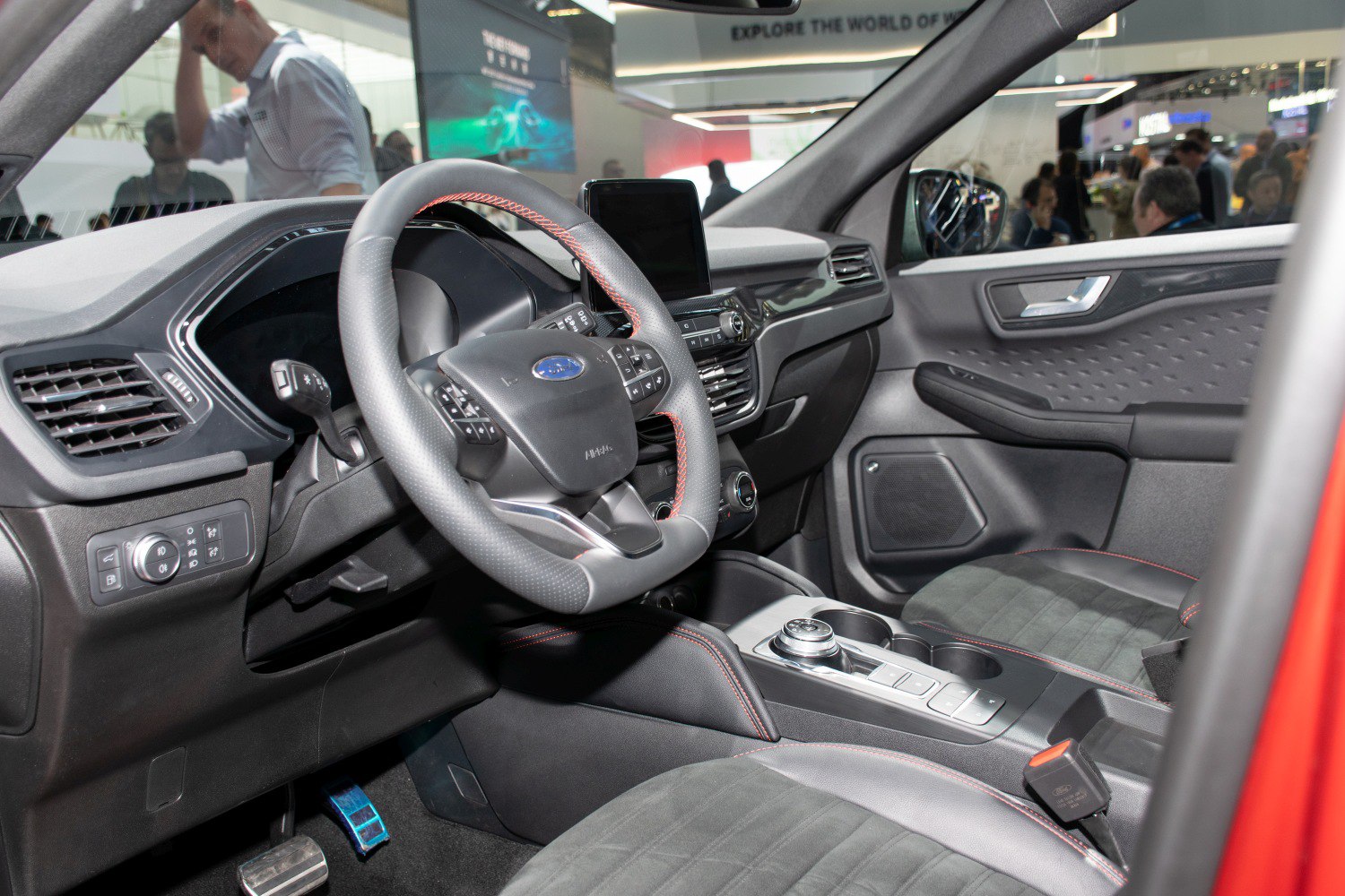 Car interior dashboard with steering wheel and central touchscreen