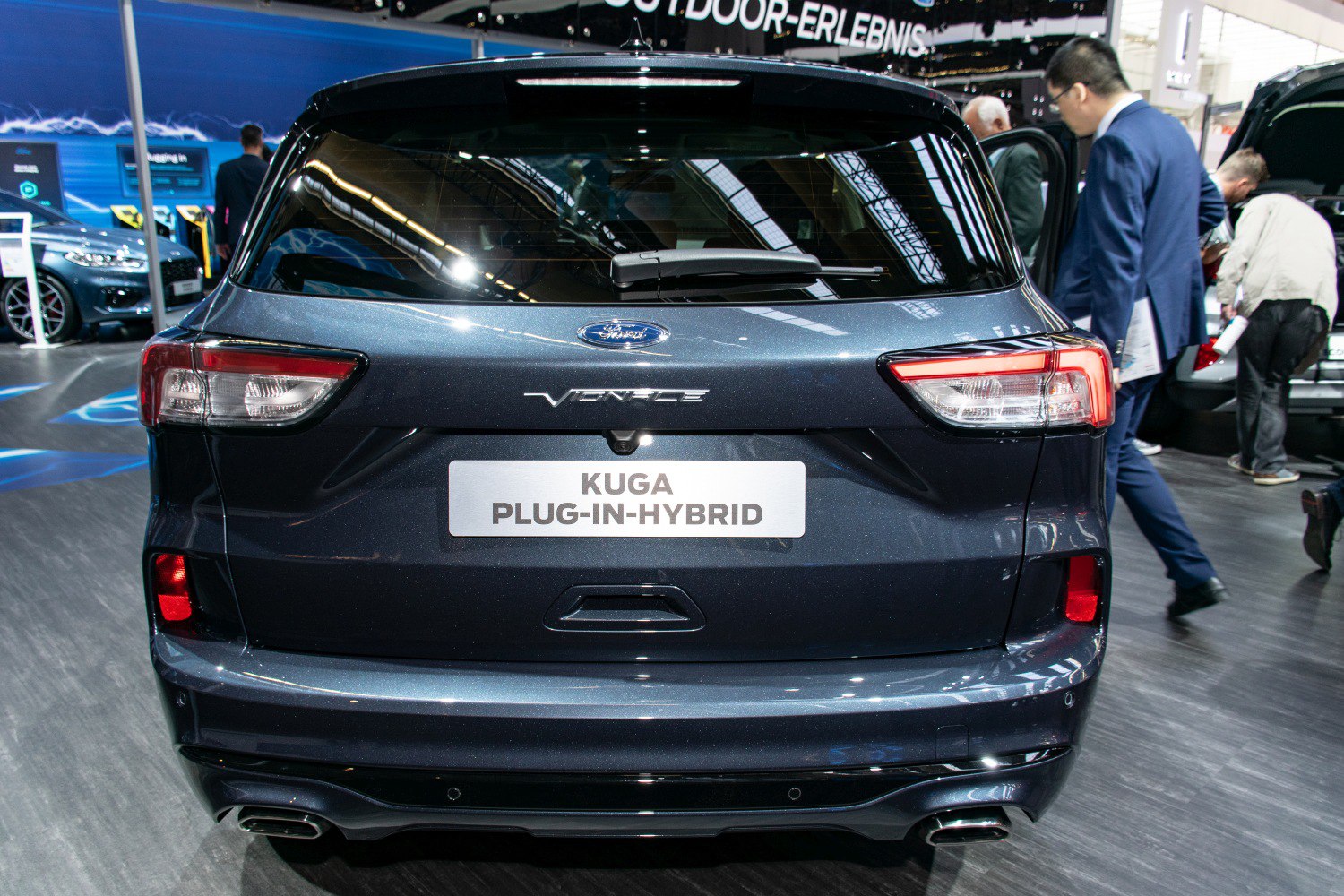 Rear view of a modern plug-in hybrid SUV with distinctive taillights and dual exhausts