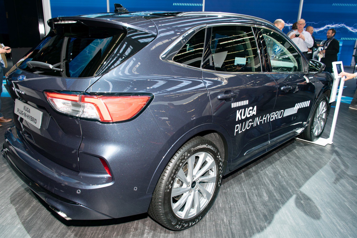 Rear and side view of a hybrid SUV with alloy wheels and distinct lighting.