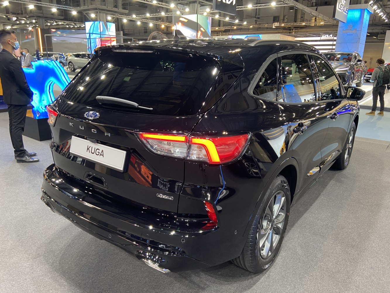 Rear view with LED taillights and hybrid badge.