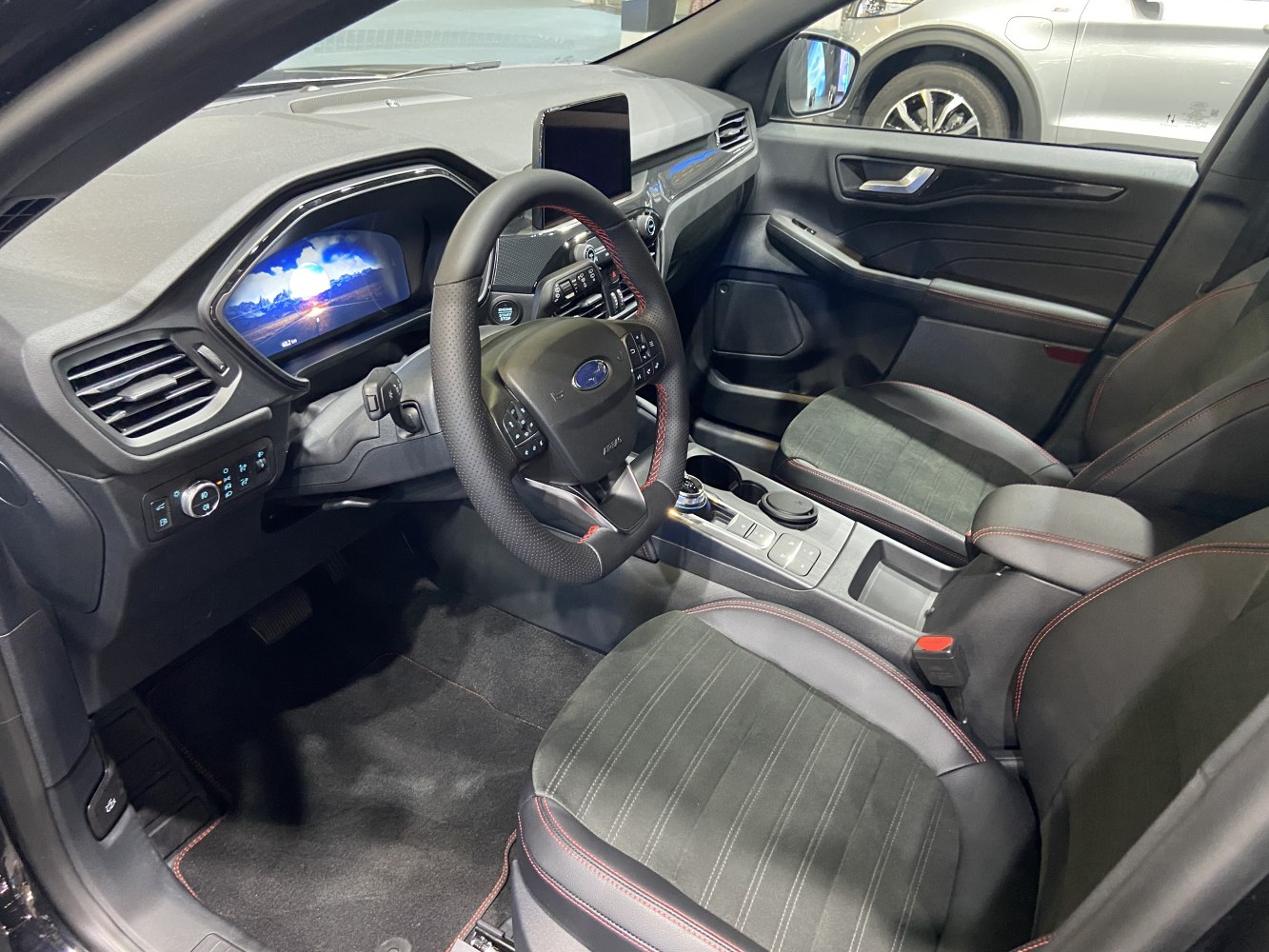 Digital dashboard display and ergonomic front seats with center console