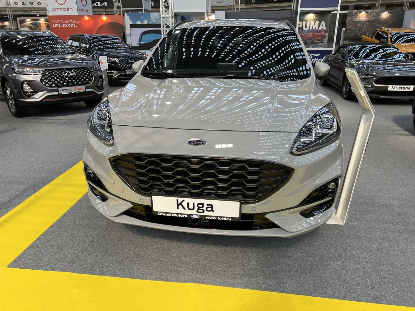 Front honeycomb grille and LED headlights of a modern SUV