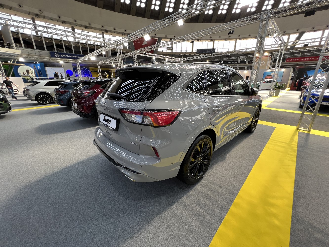 Rear and side view of a modern SUV with black alloy wheels.