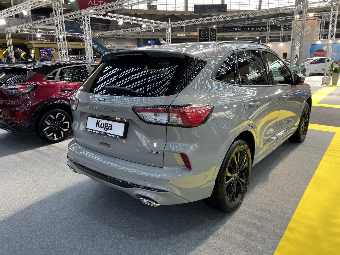 Rear view of hybrid SUV with black wheels and LED tail lights