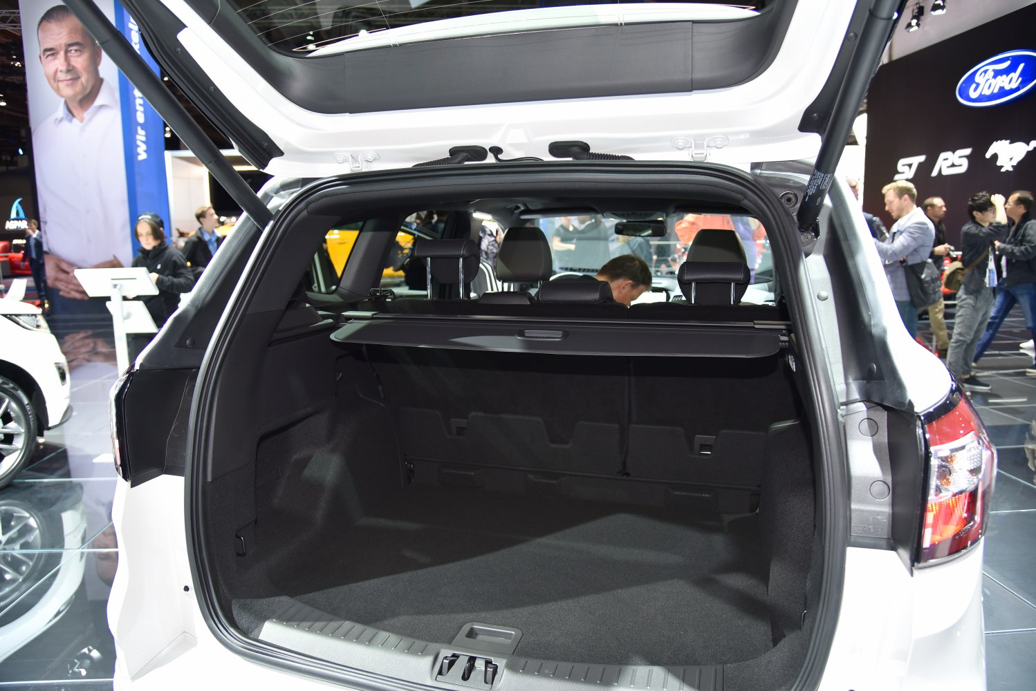 Open rear hatch and spacious cargo area with black interior trim.