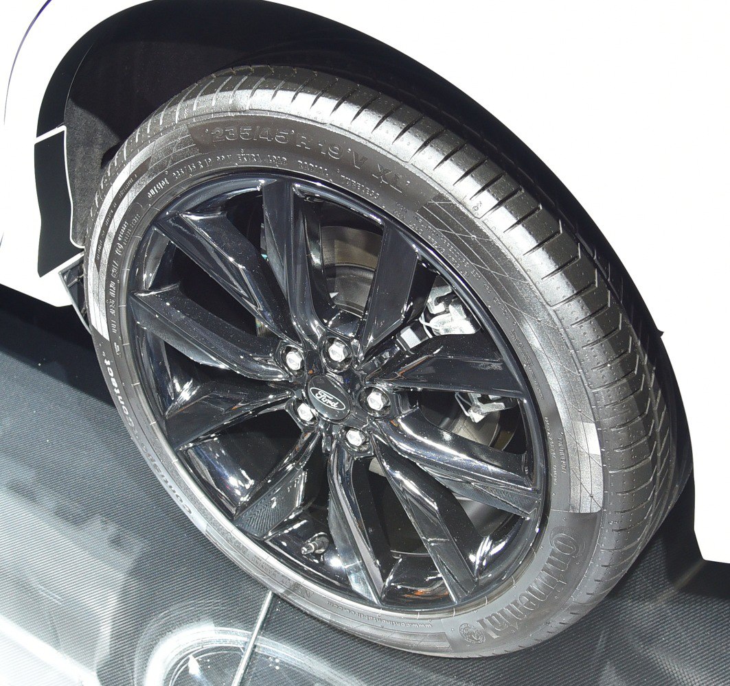 Glossy black alloy wheel with Continental tire