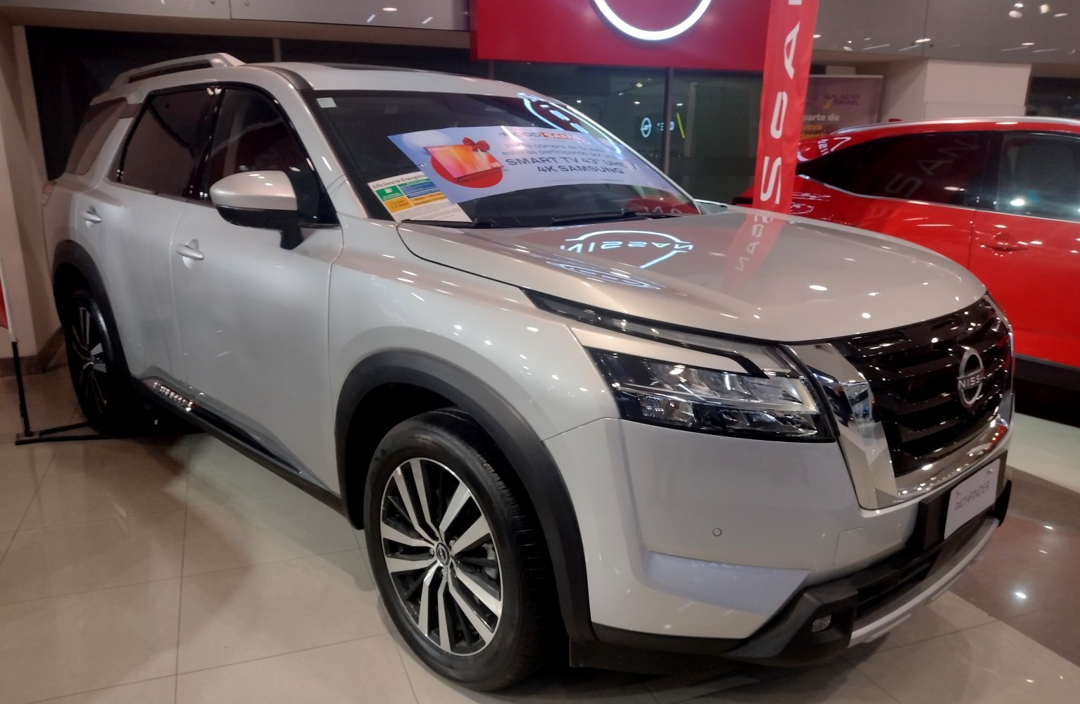 Modern SUV front fascia with detailed alloy wheel design