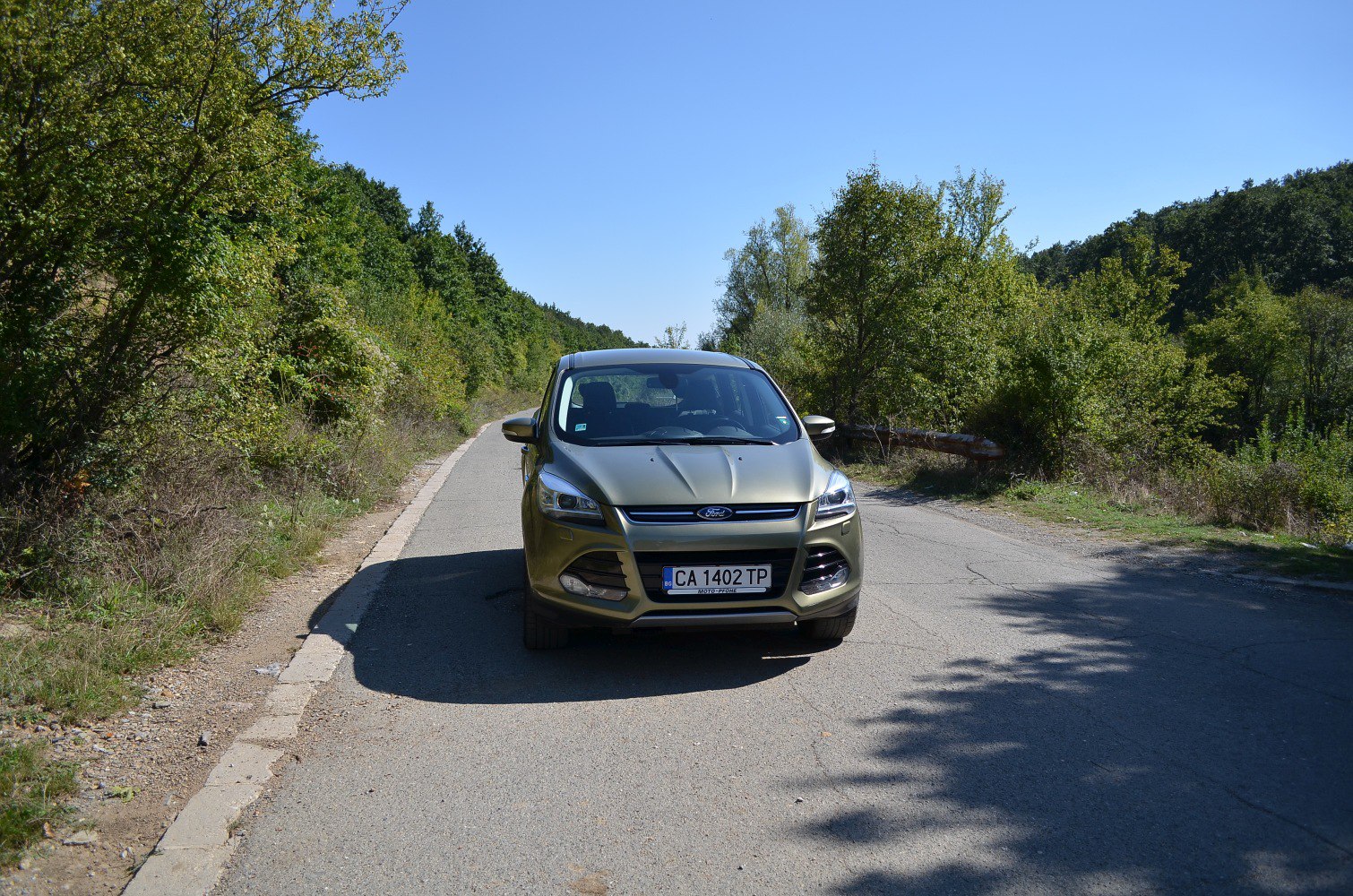 Front view of SUV with headlights and grille visible