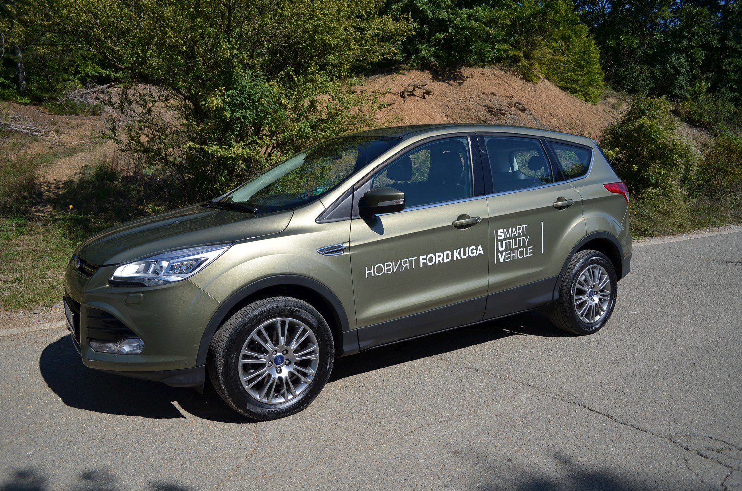 Side profile of SUV showing alloy wheels and headlight design