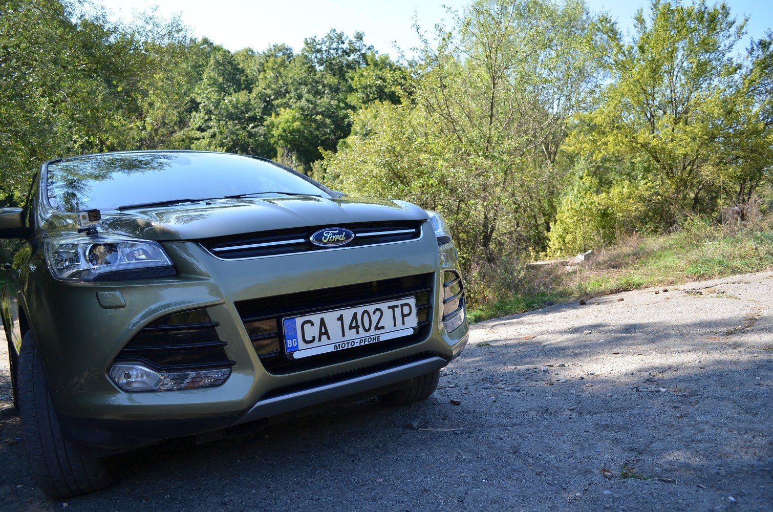 Close-up of front grille and headlights in daylight.