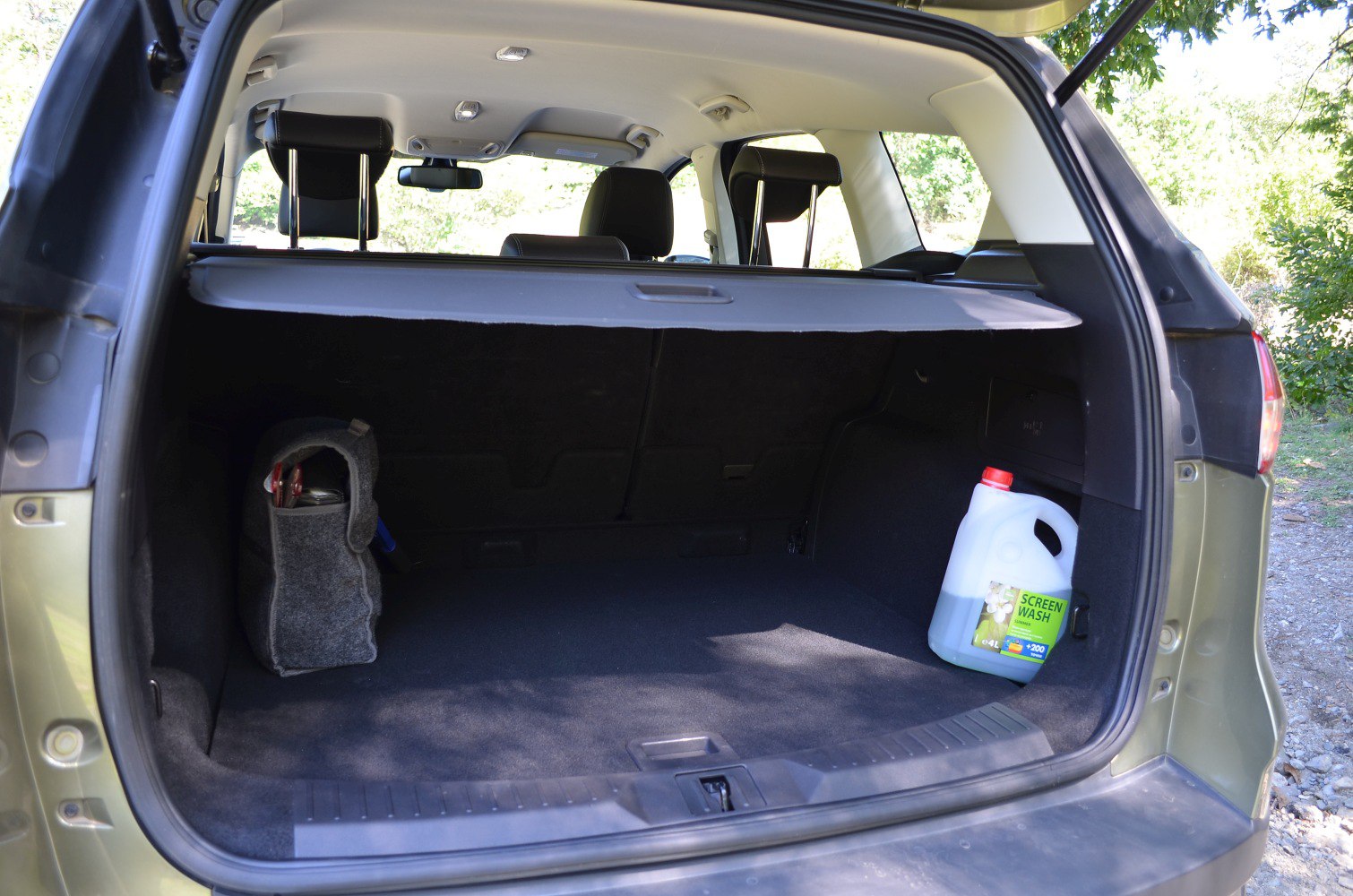 Spacious rear cargo area with retractable cover and organized storage