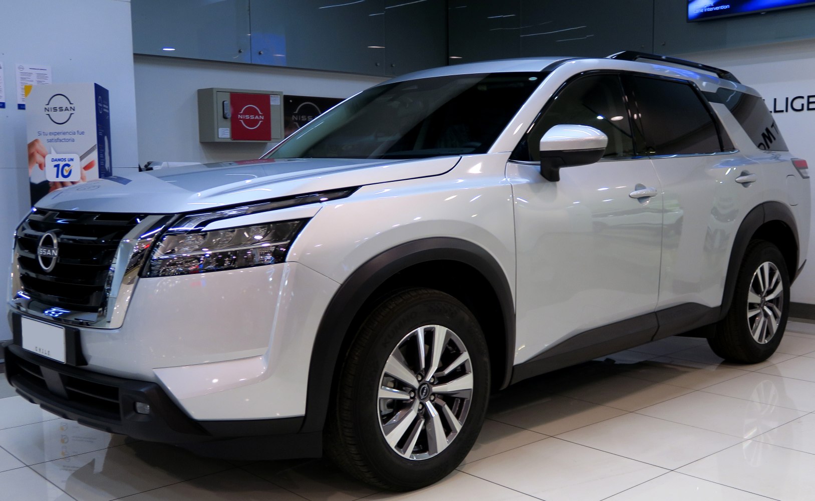 Silver SUV front side with black grille, modern headlamps, and alloy wheels