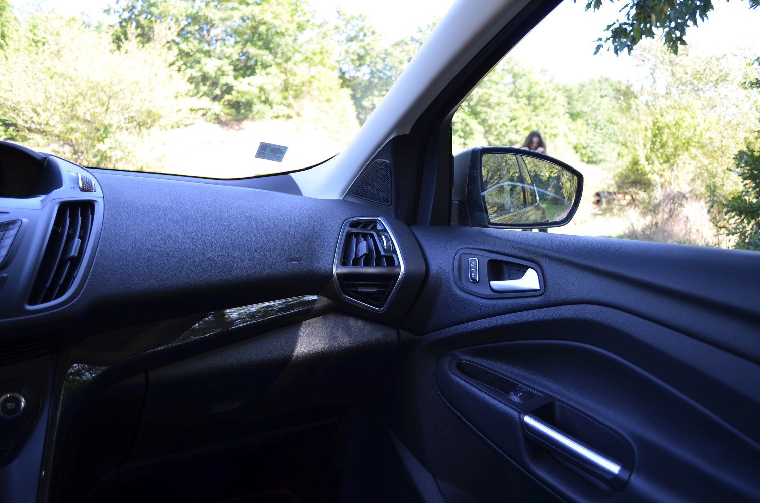 Dashboard, air vent, and door panel interior with controls