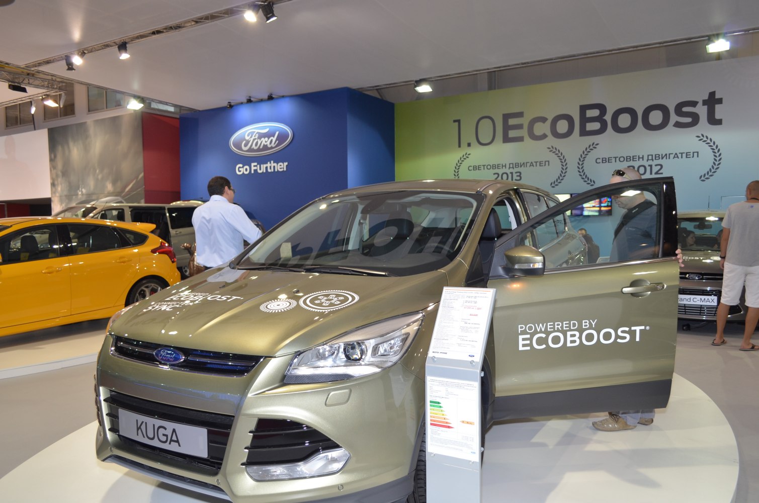 Front view of a crossover SUV with open door and EcoBoost branding