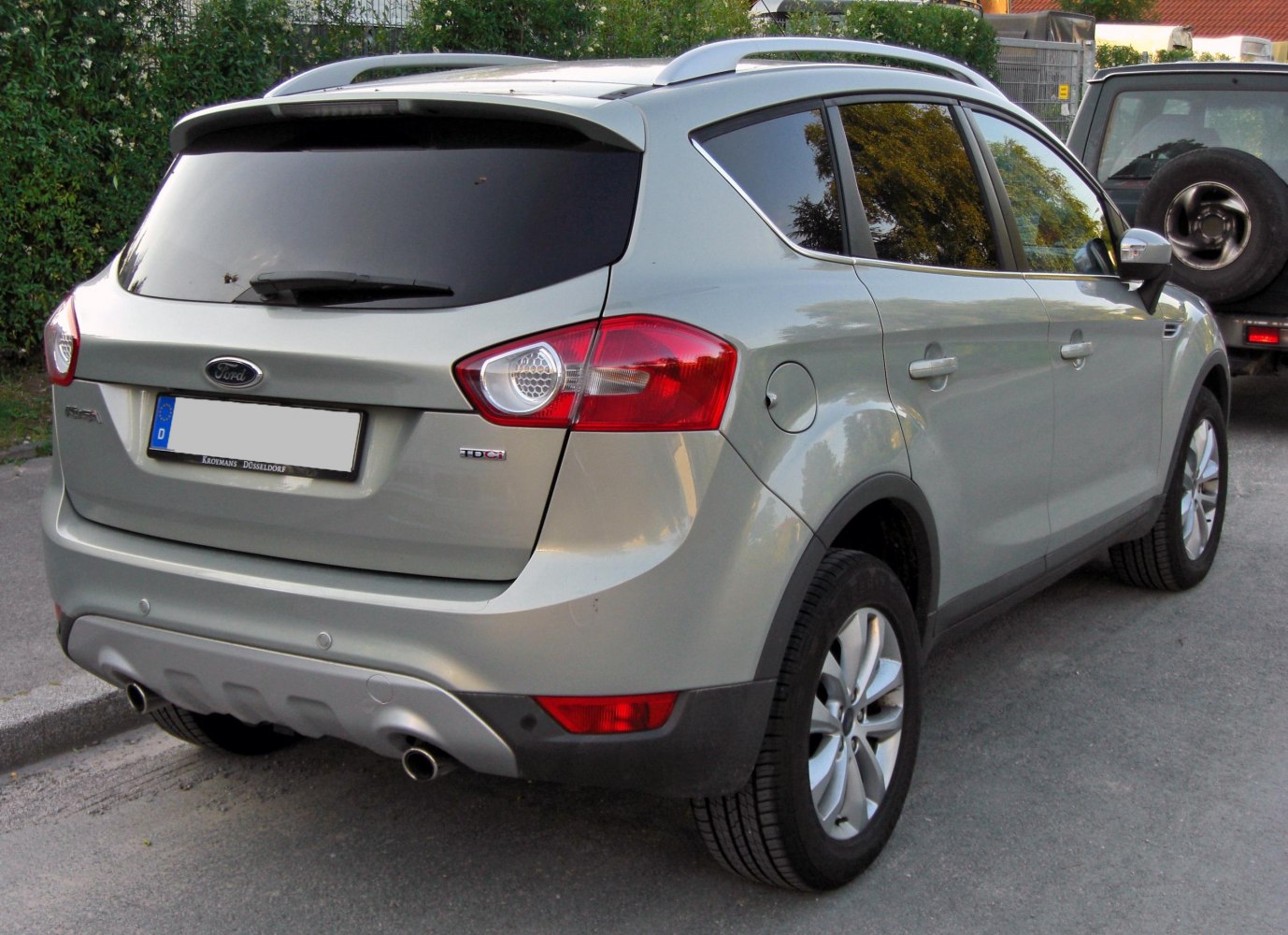 Rear view of SUV with dual exhaust and tinted rear windows