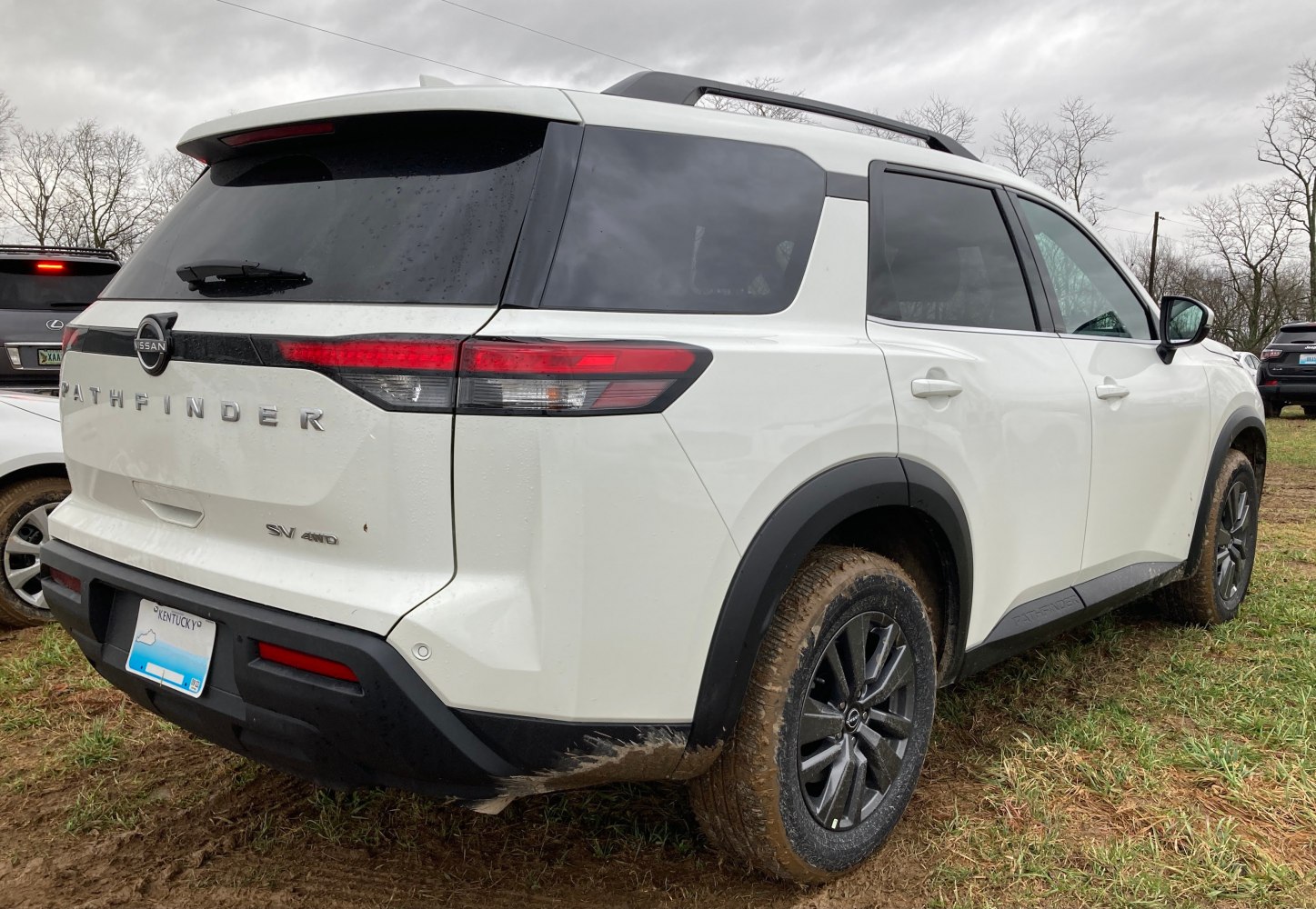 Rear and side view of SUV with off-road tires