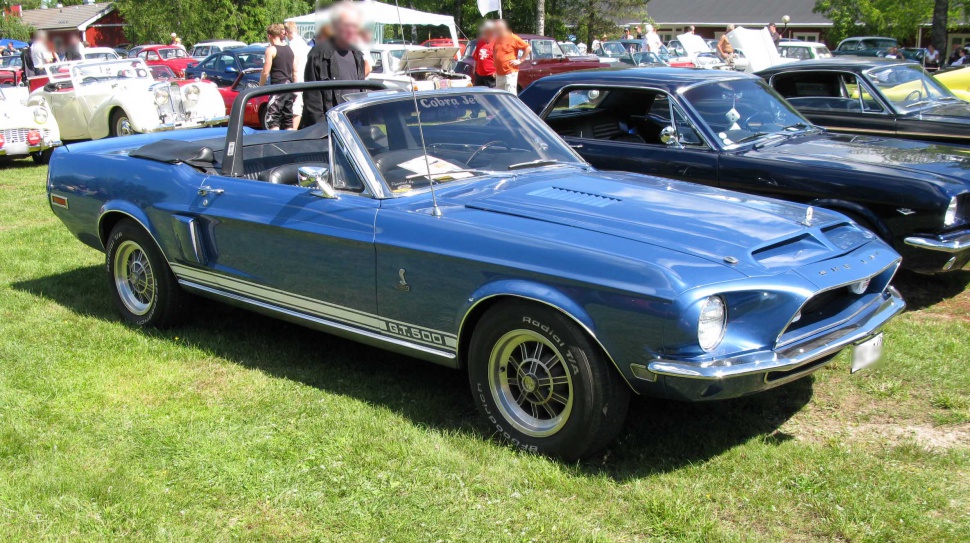 Blue convertible with side stripe, front scoop, and sport wheels