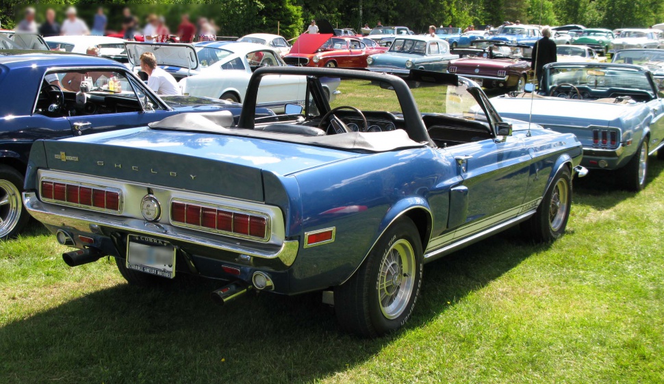 Rear view of vintage convertible with dual exhaust and classic taillights