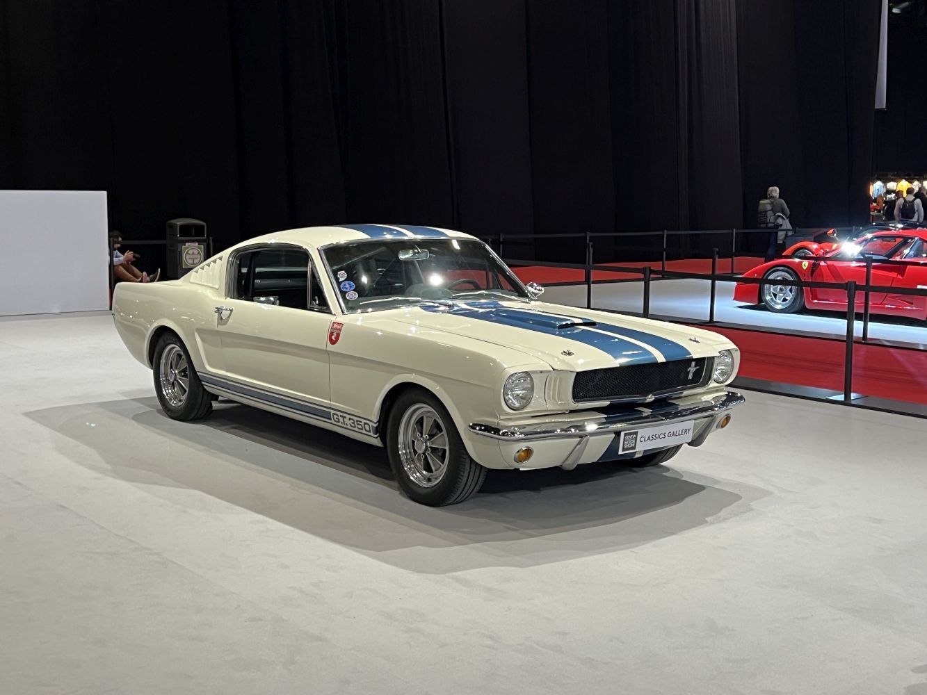 Classic fastback with dual racing stripes and distinctive hood scoop