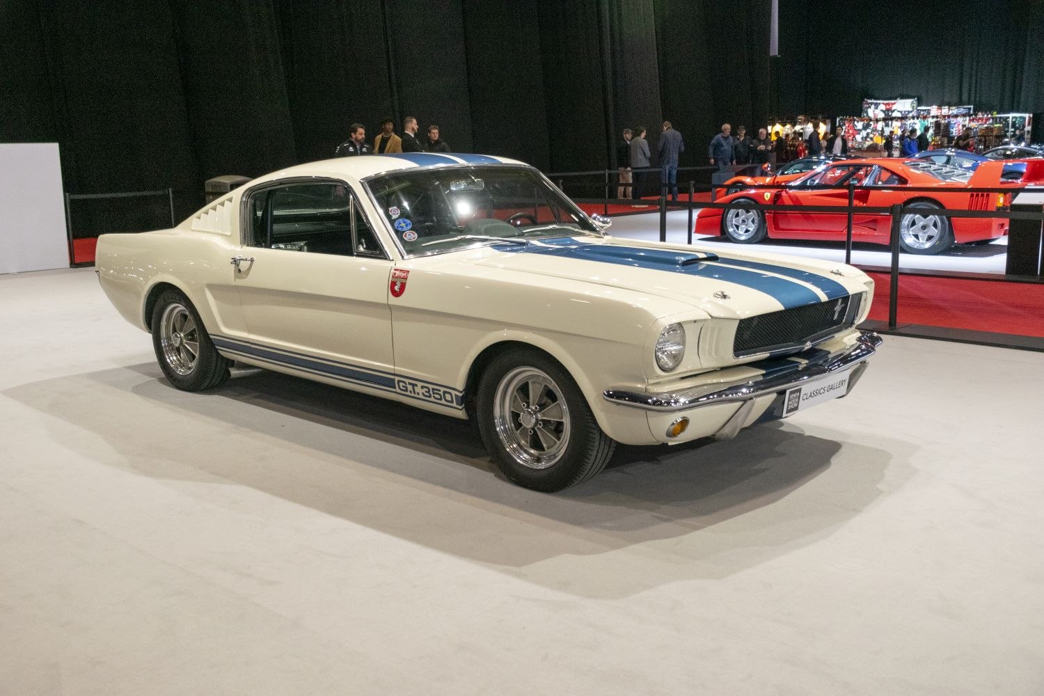 Vintage fastback coupe with racing stripes and chrome wheels