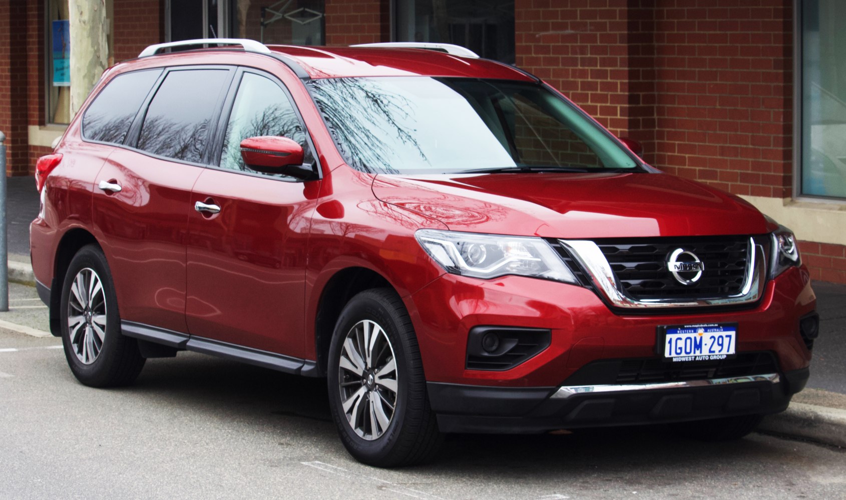 Red SUV front side with LED headlights and alloy wheels