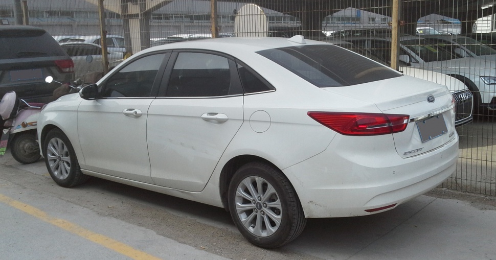 Rear side view of a compact sedan with sleek design and modern taillights