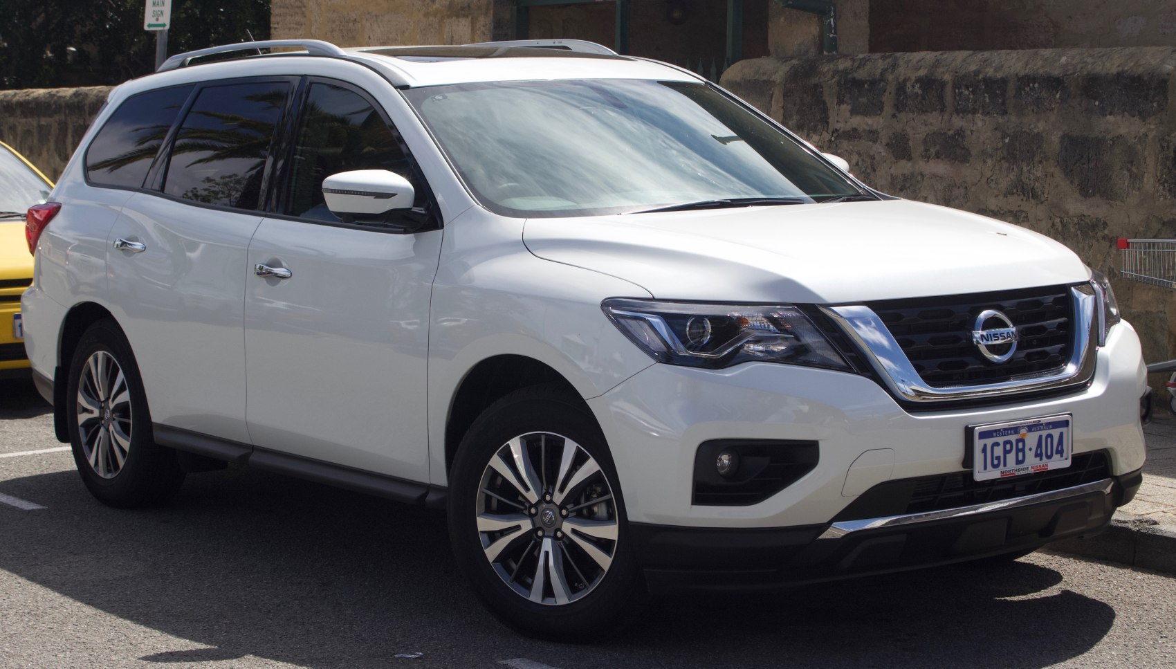 White SUV front side with distinct headlights and alloy wheels