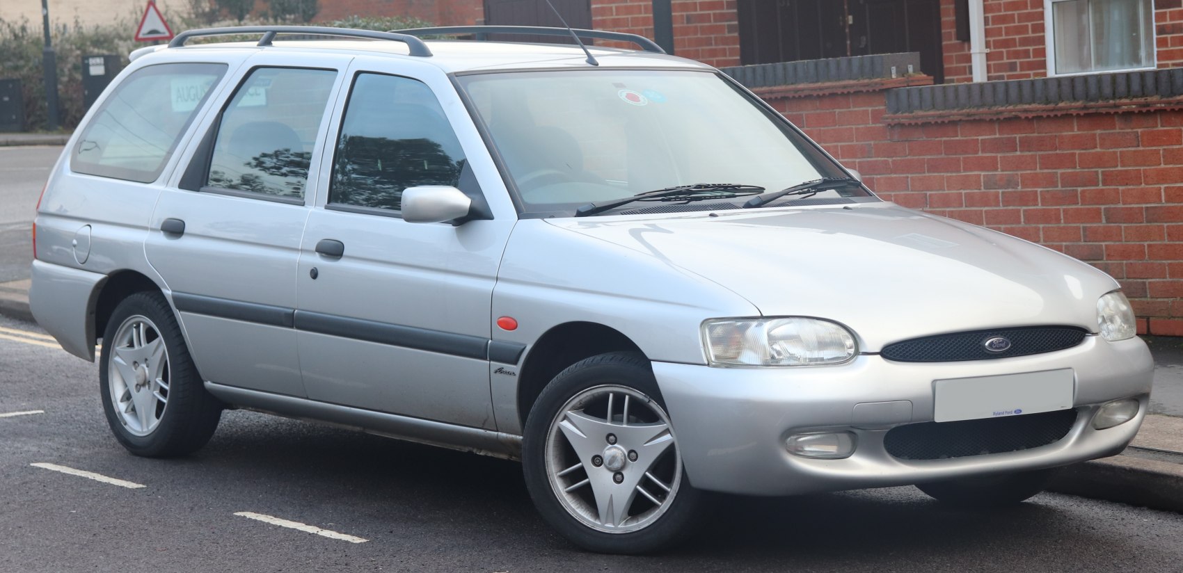Silver station wagon with roof rails and distinctive headlights