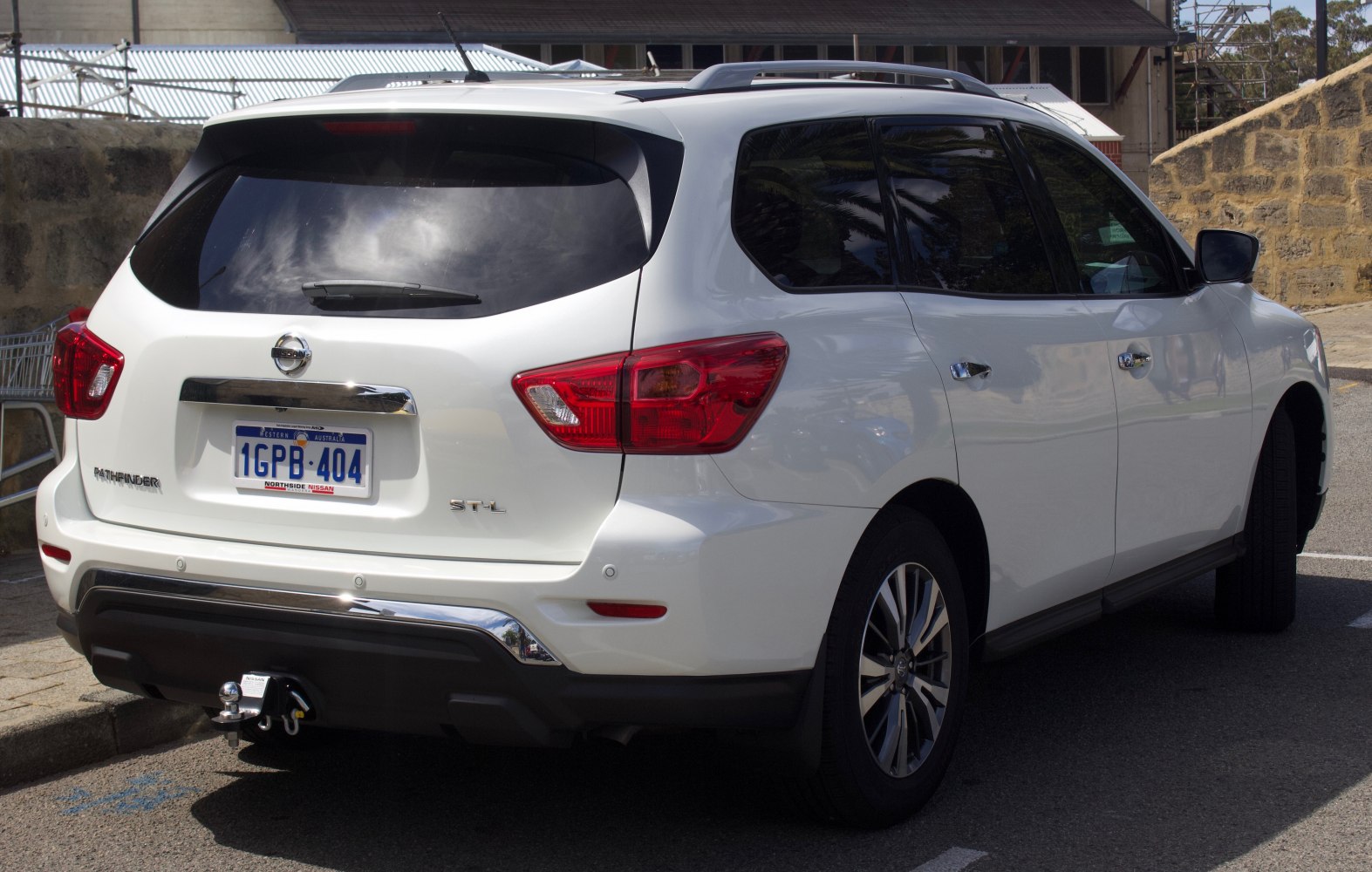 Rear view of SUV with tow hitch and distinct taillights