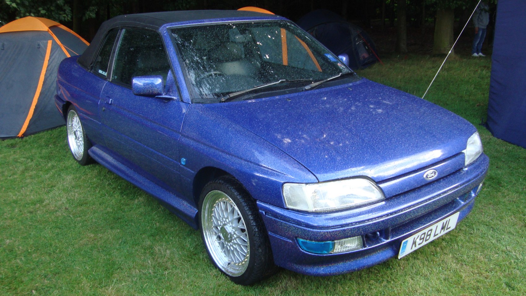 Blue 1991 convertible with sporty wheels, front-side angle